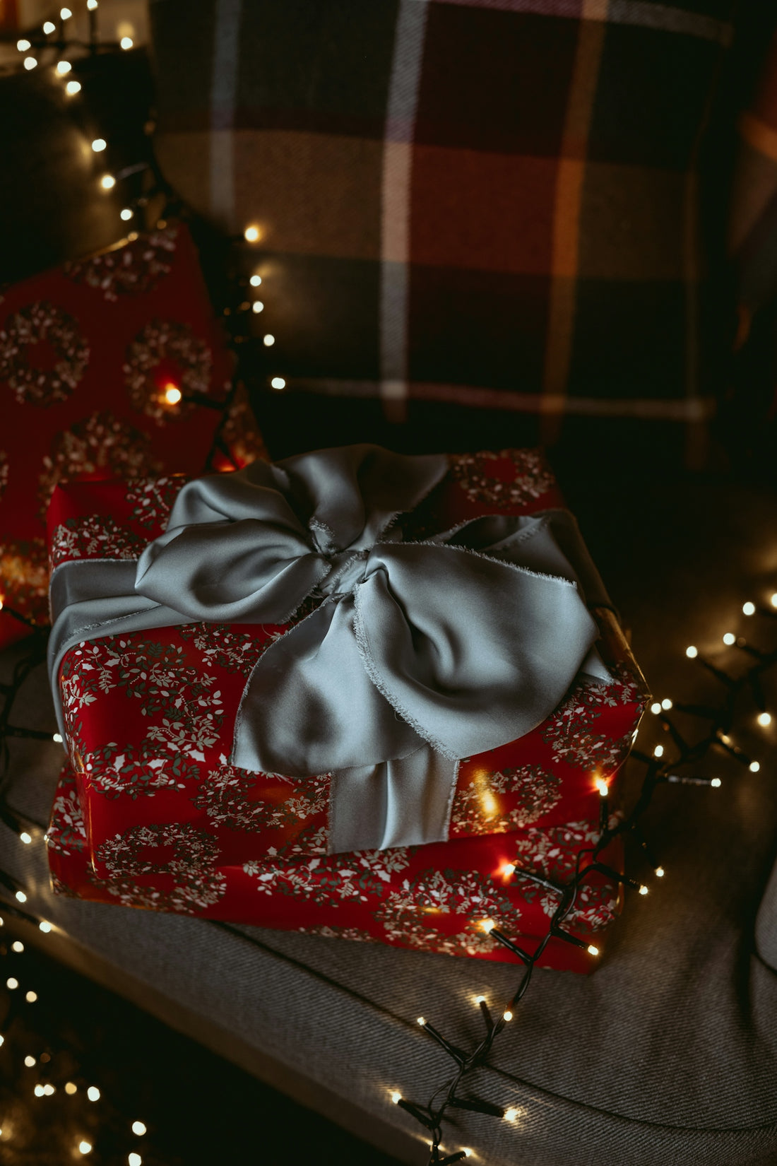 a red present box with a bow on it