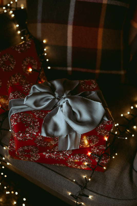a red present box with a bow on it