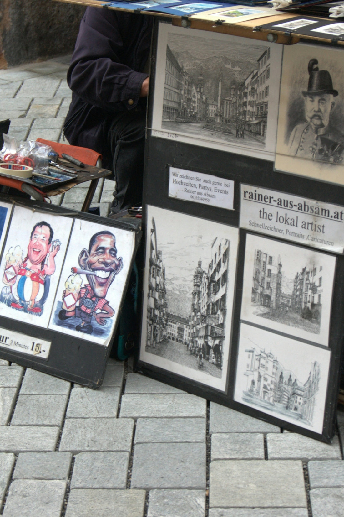 Artist displays caricatures and city sketches for sale
